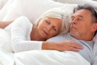 senior-couple-sleeping-together
